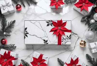 The primary subject of the image is a box with a red bow on it, which is placed on a marble surface. The setting is a Christmas-themed scene, with a variety of red and green decorations surrounding the box. The visual style is a combination of photo and digital art, creating a festive and colorful atmosphere. The dominant colors are red and green, with the red bow on the box being the most prominent feature.